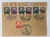 several stamps on a piece of brown paper on a white surface