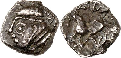 a silver coin with an image of a man on it