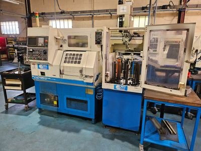 two machines that are sitting in a room together