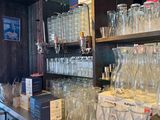 many empty glasses on the counter in the store