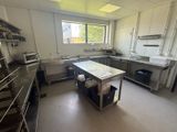 an image of a commercial kitchen with stainless steel appliances