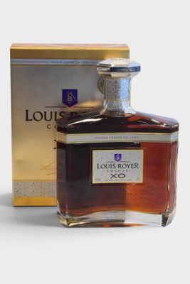 the bottle of liquor is next to a box of liquor