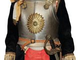 a doll of a man dressed in armor and holding a sword