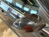 a close up of a car with a sticker on it ' s side mirror