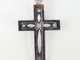 a close up of a cross on a white background