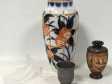 two vases that are sitting next to each other on a table