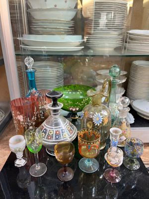 many different colored glassware on the counter top
