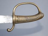 an image of a close up of a sword with a gold handle
