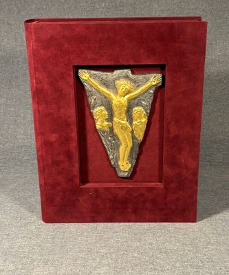 an image of a red box with a gold jesus on it