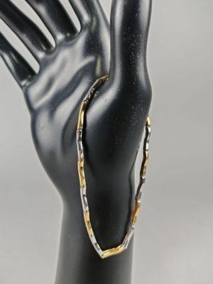 BRACELET en or jaune et gris (750/°°°).