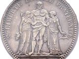 an image of a coin with a statue of a man and two women on it