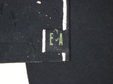 a close up of a black shirt with a white stripe