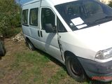 a white van that is parked in the grass