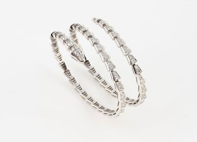 a set of three white gold and diamond bracelets