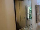 a bathroom with a sink and a mirror in it