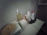 a pizza on a counter next to a bottle of lotion and a bottle of hand sanitizer