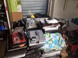 a pile of electronics sitting on the floor in a room