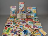 a lot of comic books on the table
