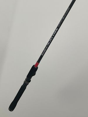 a close up of a fishing rod on a white background