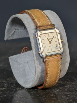 a watch that is sitting on top of a watch band