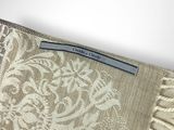 an image of a close up of a beige and white scarf