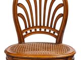 an image of a wooden chair with a wicker seat on a white background