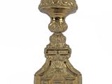 an antique brass candle holder on a white background with a white background