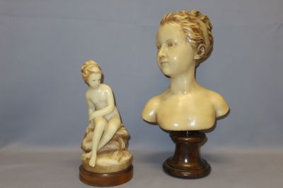 a statue of a boy and a bust of a boy