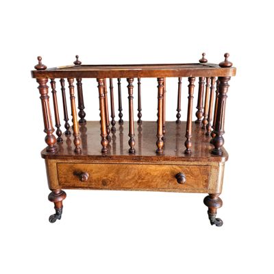 an image of a wooden magazine rack on wheels on a white background