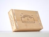 an image of a wooden box with a label on it sitting on a table