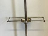 a metal stand that has a coat rack on top of it