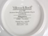 a white plate with a label on it that says villeroy & boch