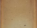 an old picture of a brown box with a small hole in it