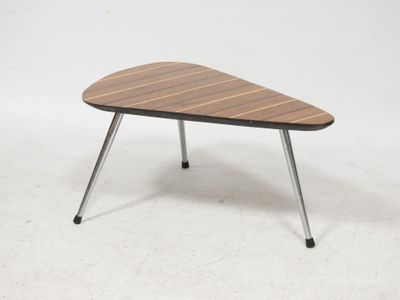 a wooden table with metal legs and a wooden top