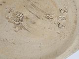 a close up of a plate with writing on it