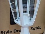 a white lamp that is sitting on a cardboard box
