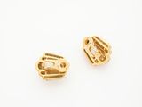 a pair of gold plated earrings on a white background