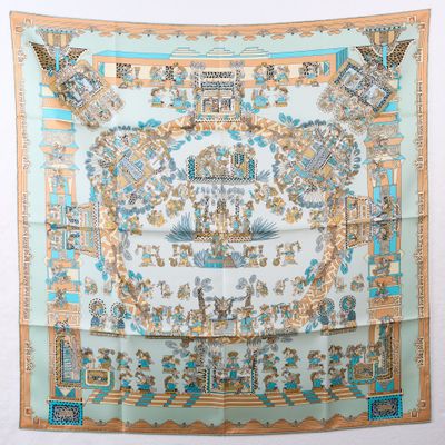 un foulard en soie bleu et blanc orné d'un motif représentant un château