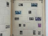 an open book with a bunch of stamps on it