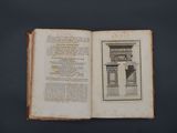 an open book with a picture of a statue on it
