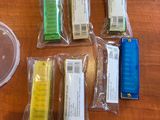 a lot of different colored items on a wooden table