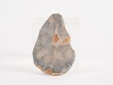 a close up of a stone object on a white surface