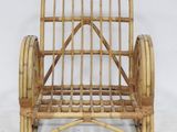 a wicker chair that is sitting on a white surface