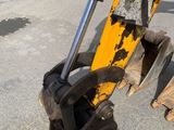 an image of a close up of a backhoe of a construction vehicle