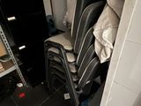 a stack of chairs and a toilet in a small room