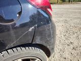 a close up of a car with a cracked tire