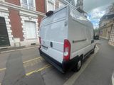 a white van that is parked on the side of the street