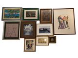 a lot of framed pictures on the wall together