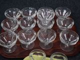 a tray of empty glasses and a tray of empty glasses on a table