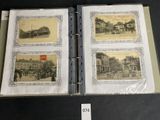 several old photos of a city are on display in a binder